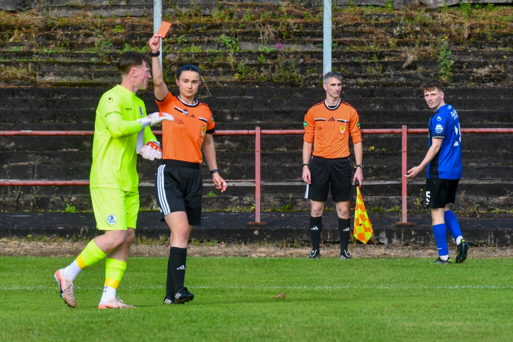 Referee Olivia Nicholson shows David Wilson (Cumbernauld Colts) a red card.